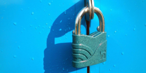 locked padlock against blue doors